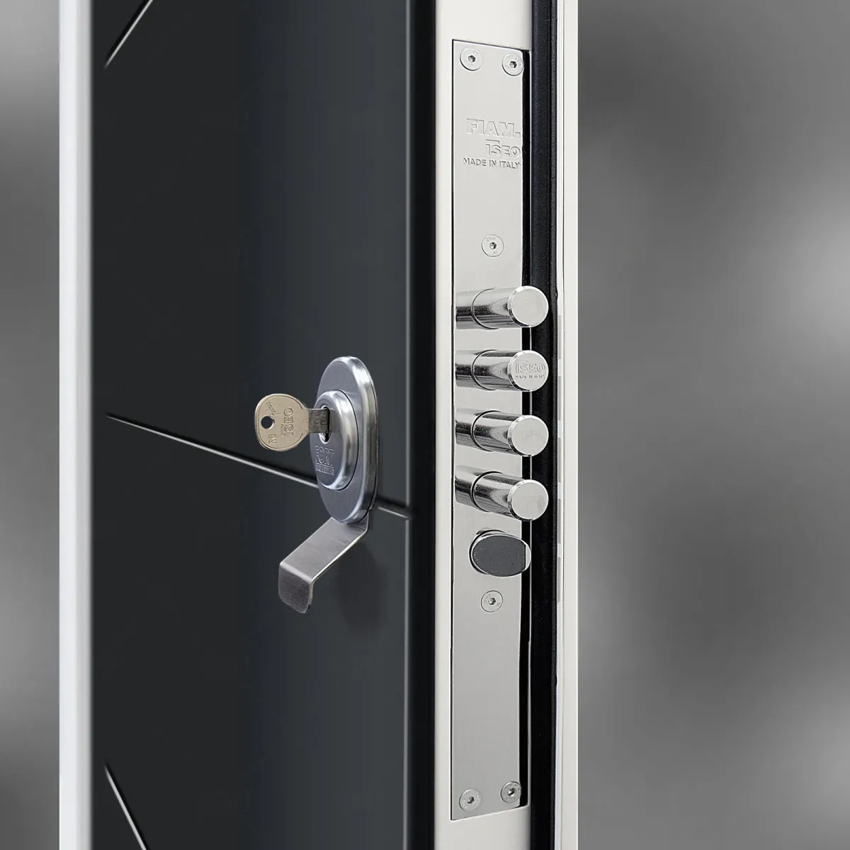Anthracite security door with a key in the cylinder and a chrome multi-point locking system on the edge