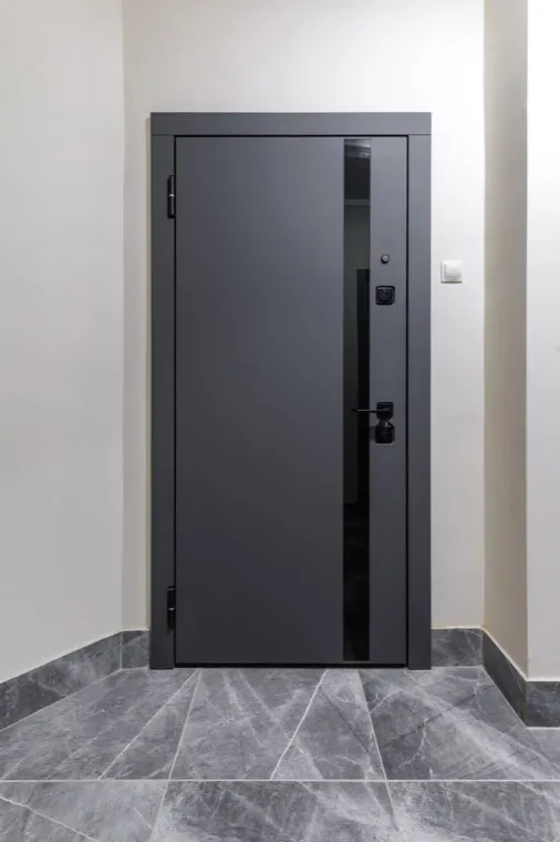 A steel commercial security door on a building entrance